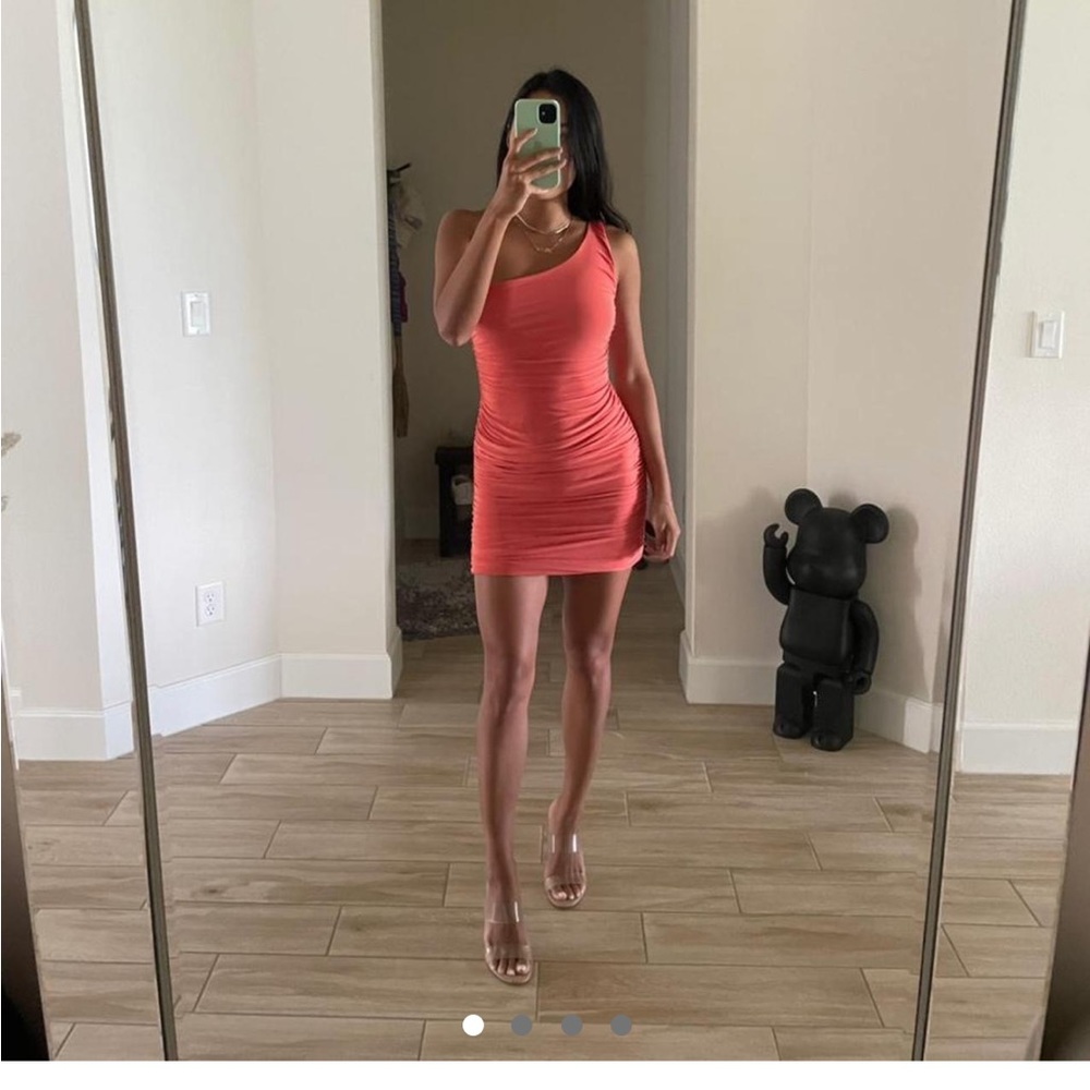 Orange one shoulder body con dress